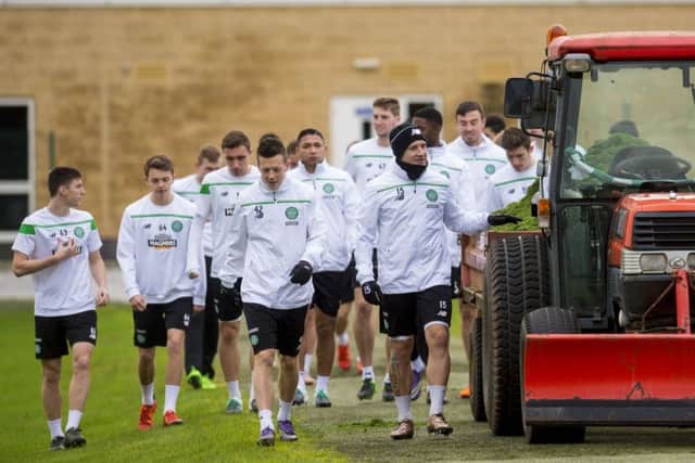 Tractor Bhoys: Kris Commons leads the Celtic players to training at Lennoxtown. The squad could be bolstered in January. Picture: SNS