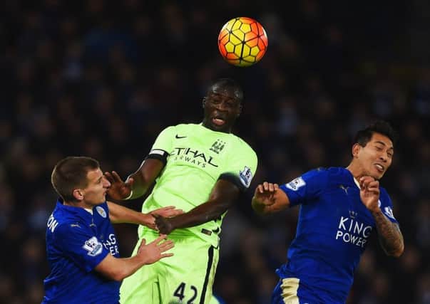 Yaya Toure of Manchester City rises above Leicesters Marc Albrighton and Leonardo Ulloa. Picture: Getty Images