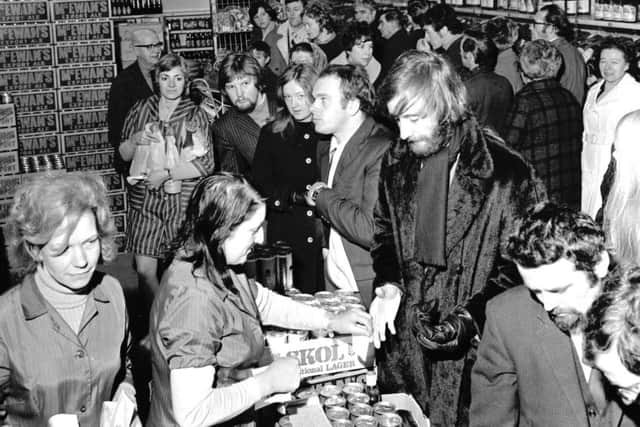 People queue up to buy their New Year drinks at Fairbairns off-licence in Albert Street Leith, in December 1971.