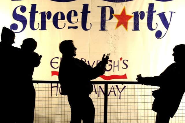 Revellers in a party mood at the Edinburgh Hogmanay street party in Princes Street, in 2001. Picture: Ian Rutherford.