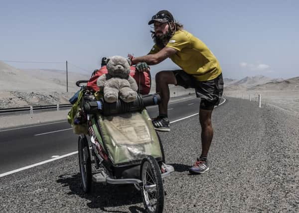 On the road: Jamie has pushed a stroller weighing 45kg (about 100lbs) for 18,000kms (11,200 miles) from North to South America. Picture: Contributed