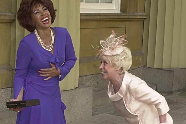 Barbara Windsor with Shirley Bassey in 2000 when she received her MBE at the Palace as Bassey became a Dame. Picture: PA