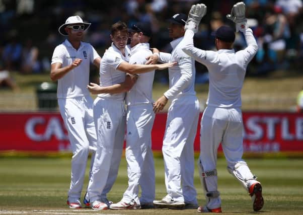 England's Chris Woakes is congratulated after taking the wicket of Dane Piedt of South Africa. Picture: Getty