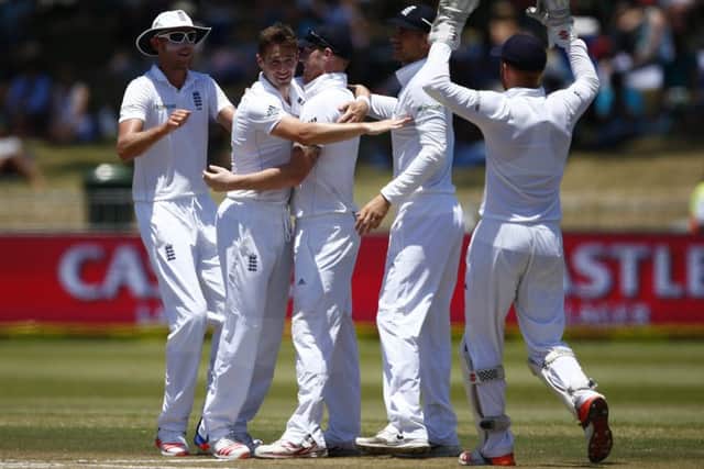 England's Chris Woakes is congratulated after taking the wicket of Dane Piedt of South Africa. Picture: Getty