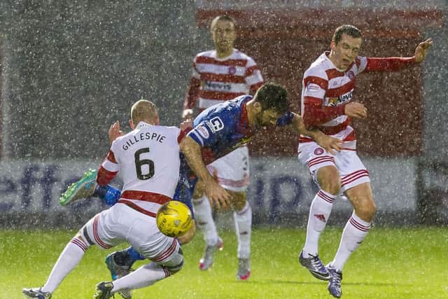Greg Tansey tussles with Grant Gillespie at a rainswept New Douglas Park. Picture: SNS Group
