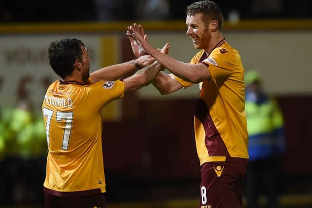 Motherwell's Stephen Pearson celebrates his goal with Scott McDonald (left). Picture: SNS