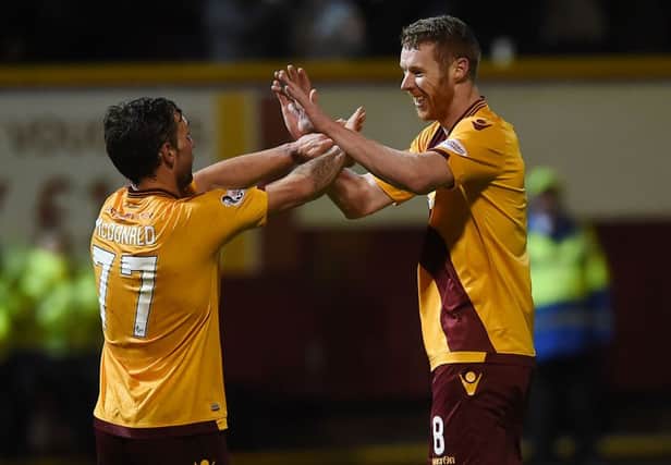 Motherwell's Stephen Pearson celebrates his goal with Scott McDonald (left). Picture: SNS
