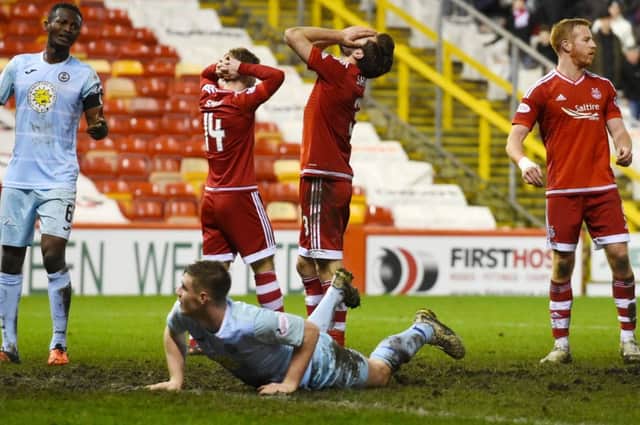 Agony for Aberdeen players Cammy Smith, Graeme Shinnie and Adam Rooney as a chance goes abegging at Pittodrie last night. Picture: SNS