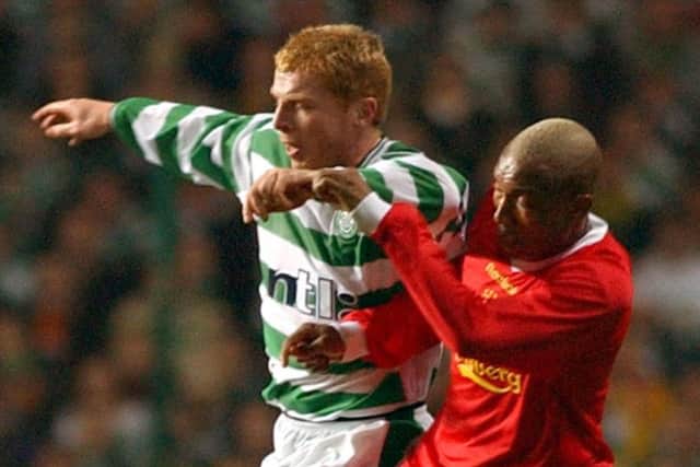 Celtic`s Neil Lennon holds off Liverpools El-Hadji Diouf in 2003