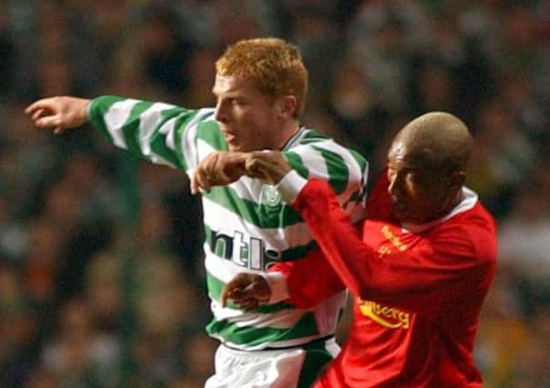 Celtic`s Neil Lennon holds off Liverpools El-Hadji Diouf in 2003