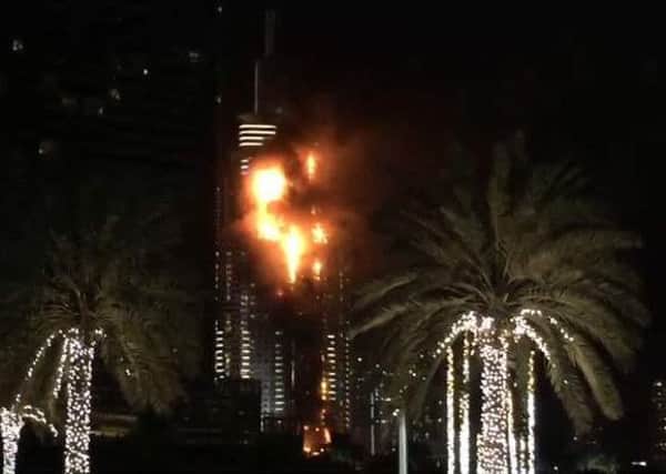 A massive fire has broken out in a high-rise building near Dubai's New Year's Eve fireworks display.  Picture: Contributed