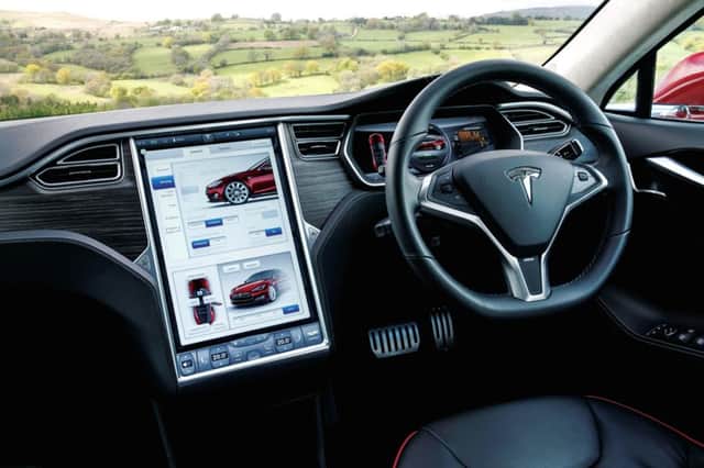 The Tesla's futuristic interior helps to monitor all aspects of the car's battery performance. Picture: Contributed