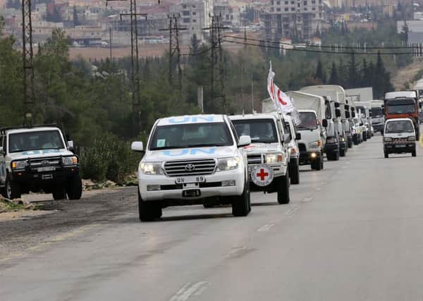 Aid convoys carrying food, medicine and blankets, leave the Syrian capital Damascus as they head to the besieged town of Madaya. Picture: AFP/Getty Images