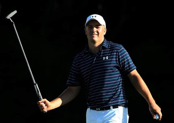 Jordan Spieth smiles after holing his birdie putt on the 15th at Kapalua Golf Club yesterday. Picture: Getty