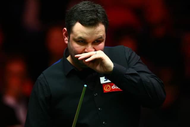 Stephen Maguire studies the table during his match against Judd Trump yesterday. Picture: Getty