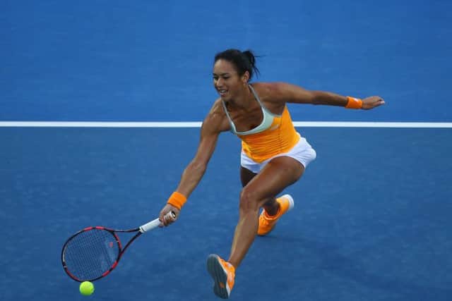 Heather Watson plays a forehand during her first-round match against Teliana Pereira yesterday. Picture: Getty