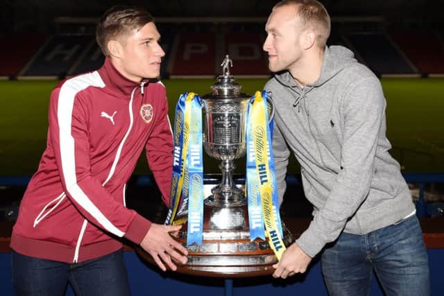 Hearts Gavin Reilly, left, and Hibernians Dylan McGeouch with the Scottish Cup. Picture: SNS