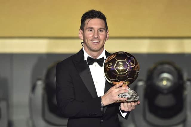 Barca and Argentina attacker Lionel Messi poses with his trophy. Picture: AFP/Getty
