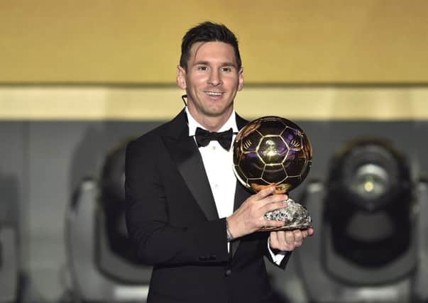 Barca and Argentina attacker Lionel Messi poses with his trophy. Picture: AFP/Getty