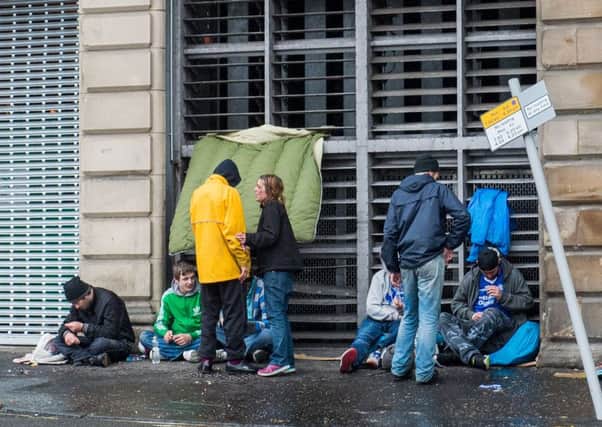 Homeless people gather to keep warm and dry at the back of The Carlton Hotel, Jeffrey street. Picture: Ian Georgeson
