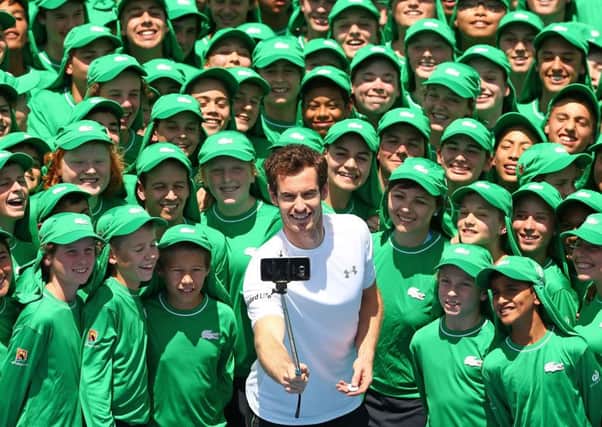 Andy Murray takes a selfie with ballkids ahead of the 2016 Australian Open at Melbourne Park. Picture: Getty Images