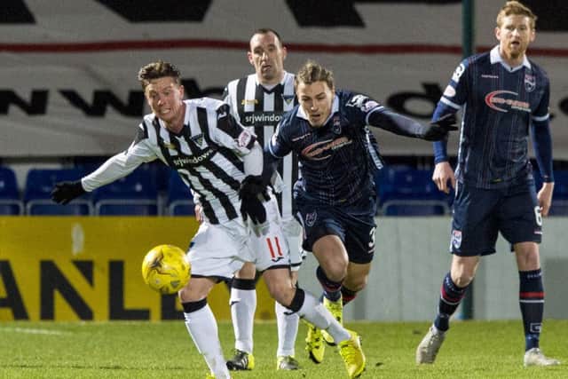 Ross County's Jackson Irvine (right) challenges Dunfermline midfielder Joe Cardle at Dingwall last night. Picture: Getty Images.
