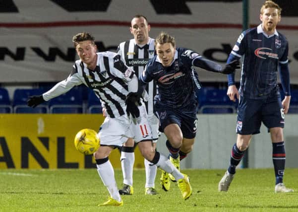 Ross County's Jackson Irvine (right) challenges Dunfermline midfielder Joe Cardle at Dingwall last night. Picture: Getty Images.