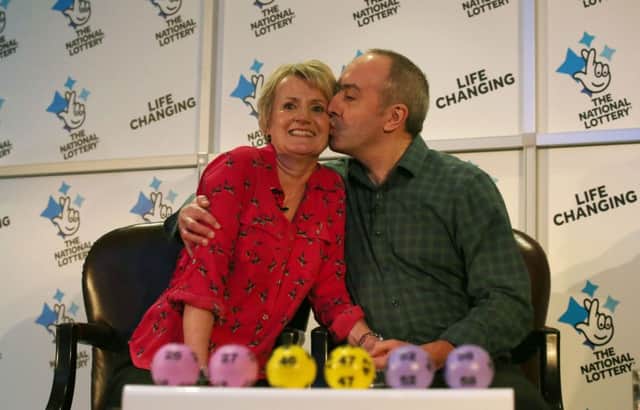 David and Carol Martin, a husband and wife from Hawick, celebrate at the Dalmahoy Hotel & Country Club in Edinburgh after winning half of the historic Â£66 million Lotto jackpot.