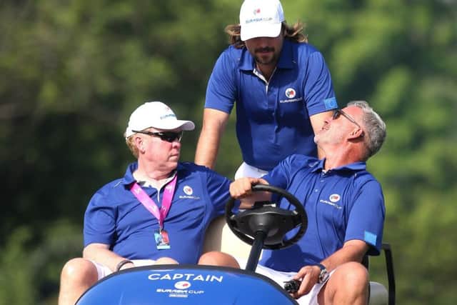 European captain Darren Clarke, right, talks with Victor Dubuisson of France during the first practice day at the EurAsia Cup in Malaysia.  Picture: Mark Dadswell/AFP/World Sport Group