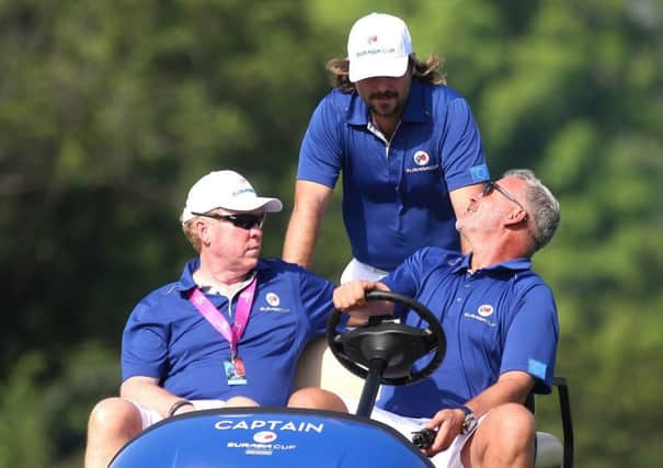 European captain Darren Clarke, right, talks with Victor Dubuisson of France during the first practice day at the EurAsia Cup in Malaysia.  Picture: Mark Dadswell/AFP/World Sport Group