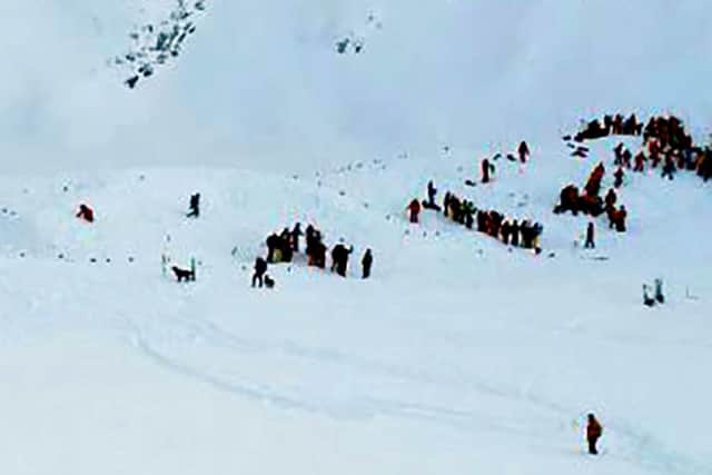Rescuing teams gather for search and rescue operations on a piste at the avalanche site. Picture: AFP/Getty Images