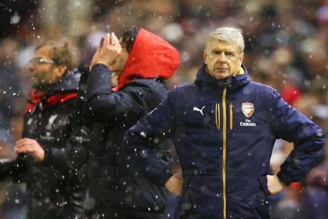 Arsenal manager Arsene Wenger is left distraught after Liverpool's equalising goal in the 90th minute. Picture: Getty Images