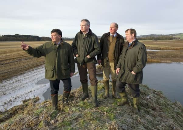 Allan Bowie, Richard Lochhead, farmer Bob Strachan and Terry AHearn were shown flooded farmland in Perthshire. Picture: Ian Rutherford