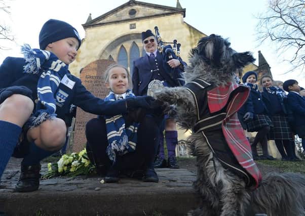 George Heriot School pupils at the grave side today. Picture: Jon Savage