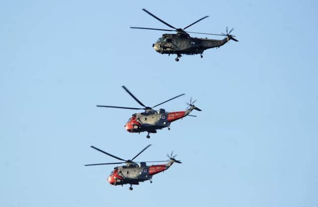 Royal Navy Search and Rescue flew over Edinburgh as part of their farewell flypast over the areas they used to serve.
 Picture: Neil Hanna