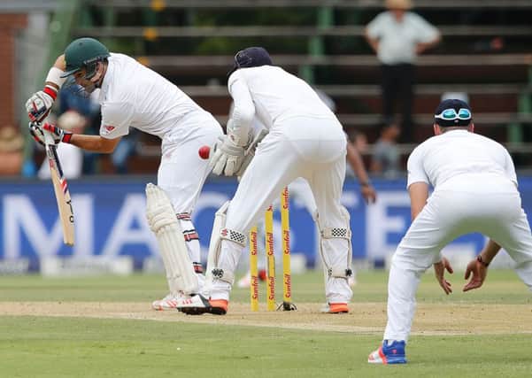 Jonny Bairstow takes the catches South Africa batsman Dean Elgar off the bowling of Moeen Ali. Picture: AFP/Getty Images