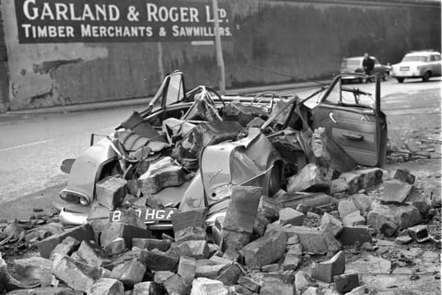 A car outside Garland & Roger sawmill was crushed by masonry after the January gales in Edinburgh in 1968.