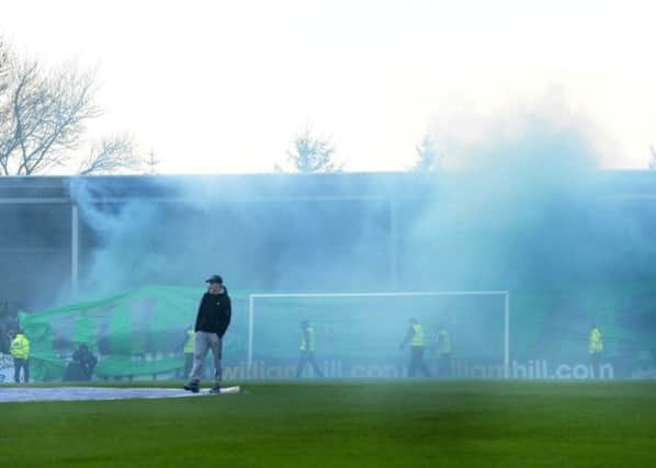 Aftermath of flares thrown at Stranraer during cup clash with Celtic