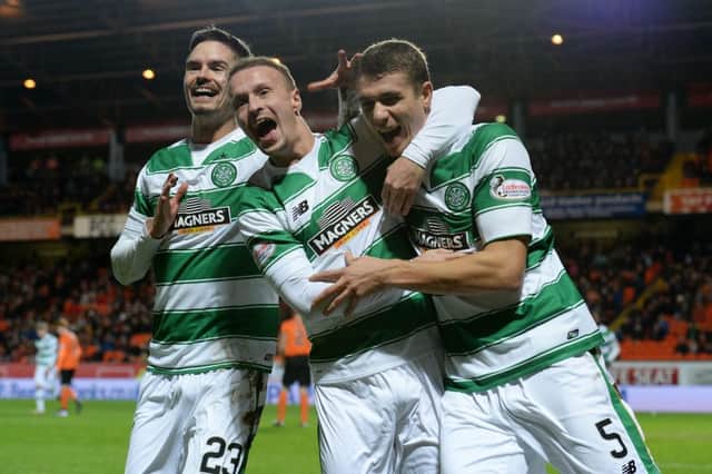 Celtic's Jozo Simunovic (left) celebrates with his team-mates after putting his side 2-0 up. Picture: SNS