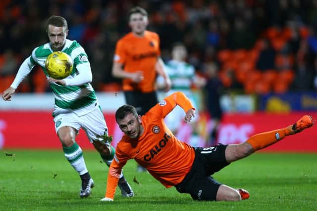 Gavin Gunning (falling over) is a weak link in the United defence but Leigh Griffiths had a fine game. Picture: Getty