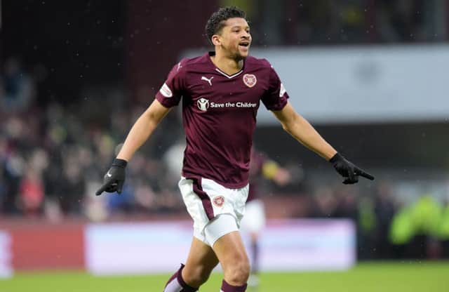 Sow easy: Osman Sow wheels away after putting Hearts 2-0 up. Picture: SNS Group