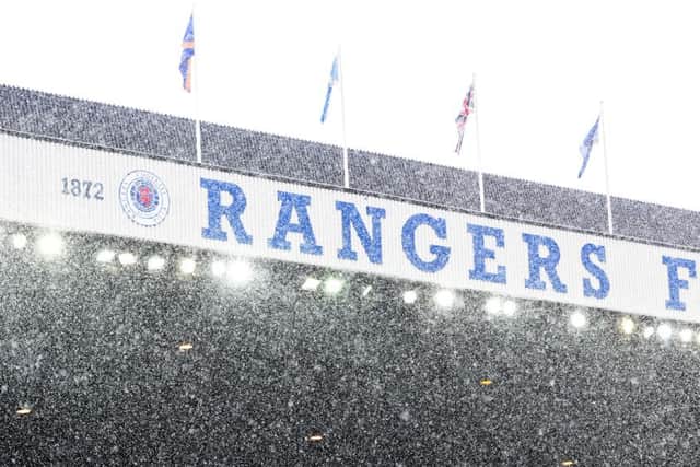 The snow came down at Ibrox but never threatened the match. Picture: SNS Group