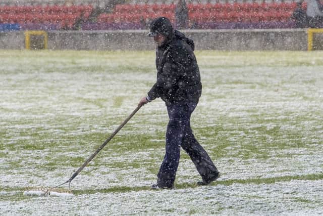 Partick Thistle groundstaff tend to the pitch at half time. Picture: SNS Group