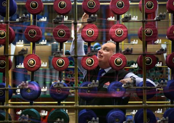 CEO of SYHA Hostelling Scotland, Keith Legge launches the tartan design competition at the Tartan Weaving Mill in Edinburgh. Picture: PA