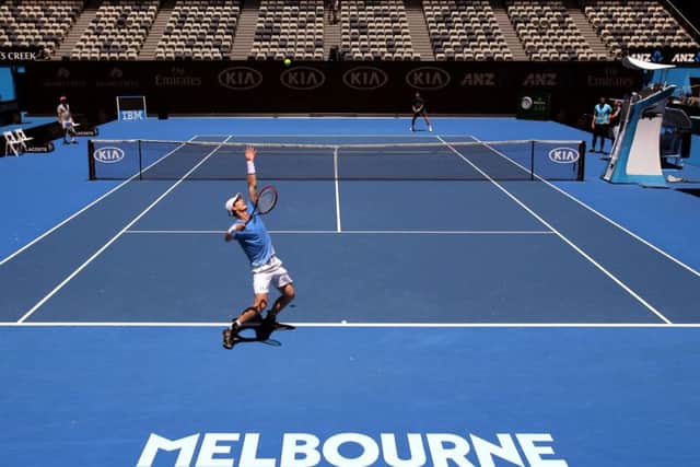 Andy Murray serves during a practice session in Melbourne on Saturday and takes a breather while he contemplates taking on Alexander Zverev in the first round of the Australian Open tomorrow. Picture: AP