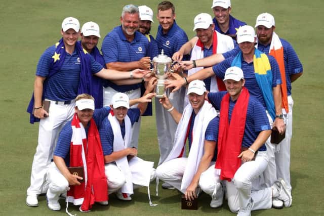 Team captain Darren Clarke with his victorious European side who were emphatic 13-point winners over Asia in Kuala Lumpur. Picture: AFP/Getty