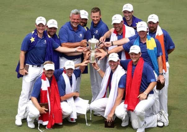 Team captain Darren Clarke with his victorious European side who were emphatic 13-point winners over Asia in Kuala Lumpur. Picture: AFP/Getty