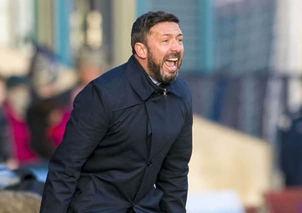 Aberdeen manager Derek McInnes roars out instructions during yesterday's win. Picture: SNS