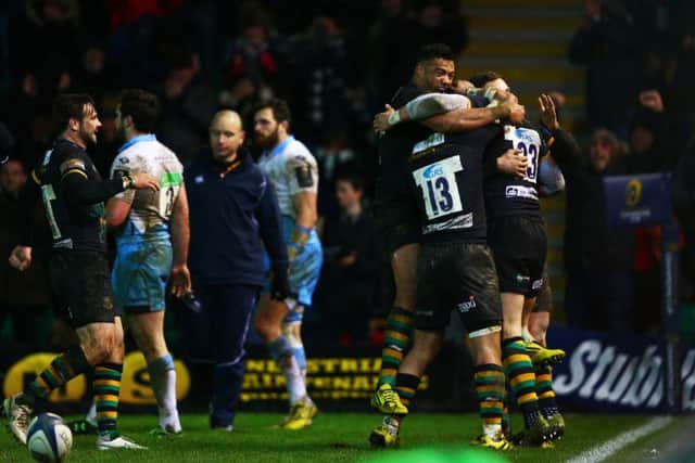 Harry Mallinder congratulated by teammates after scoring the match-winning try. Picture: Getty