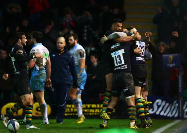 Harry Mallinder congratulated by teammates after scoring the match-winning try. Picture: Getty